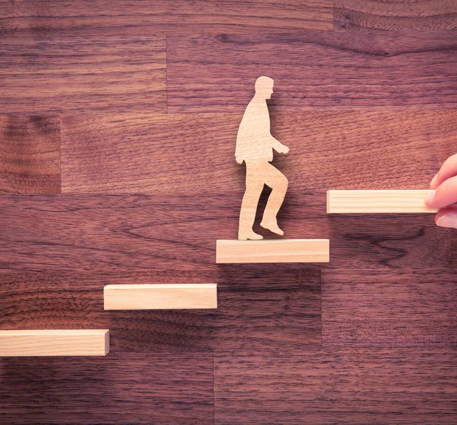 a person walking on a wooden staircase