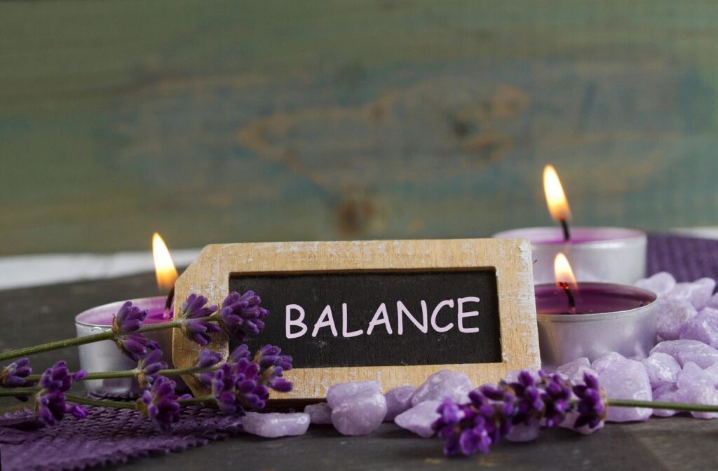 a lavender flowers and candles on a table